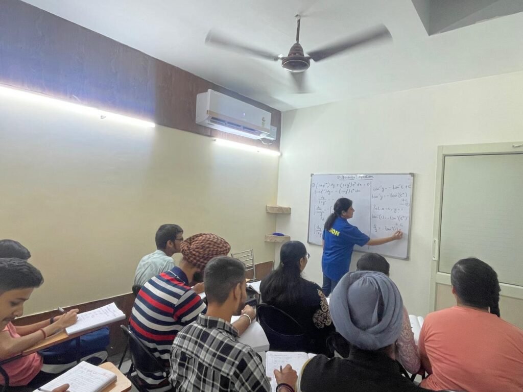 Students attending a mathematics class at Vision Classes, focused on learning and problem-solving.