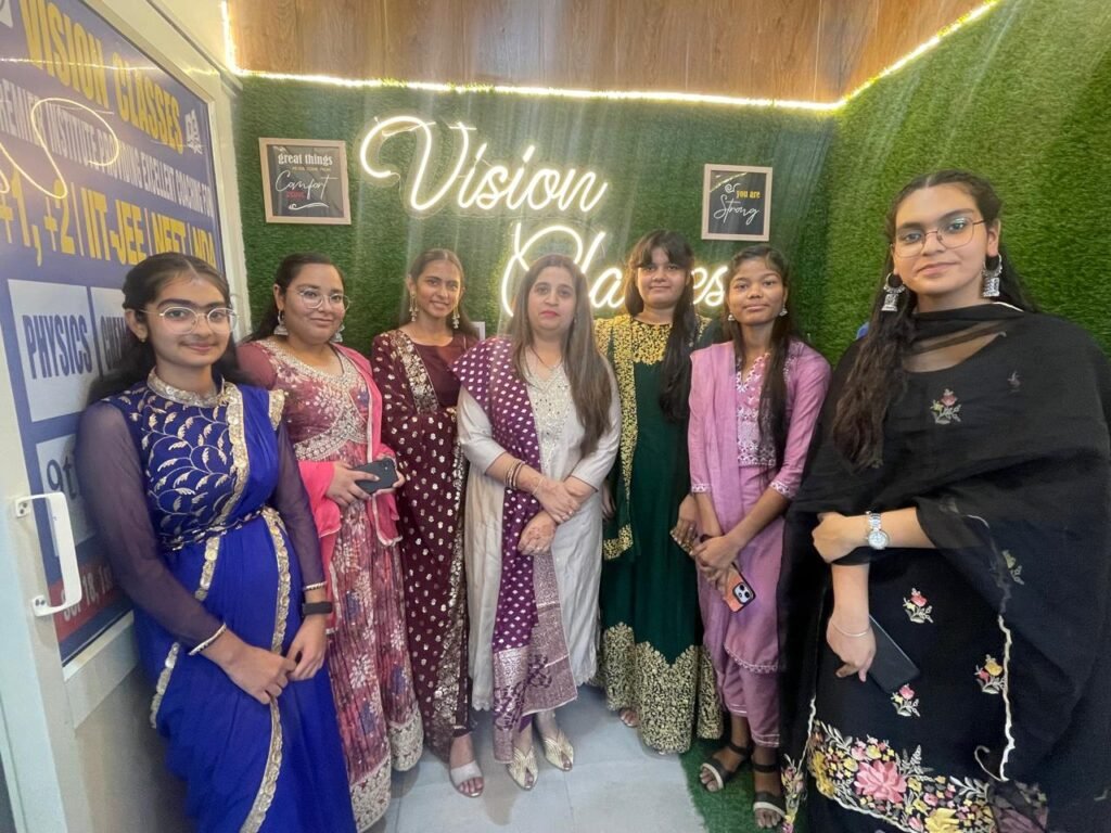 Diwali celebration at coaching institute with students, teachers, and festive decorations.